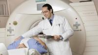 Doctor performing a CT scan on a patient